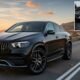 Mercedes-Benz GLE Coupe on road, showcasing sleek coupe design, luxury SUV features, and modern exterior styling